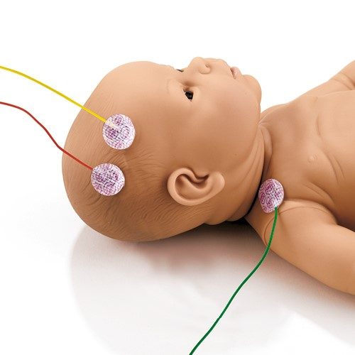 Babypuppe mit runden Elektroden auf Kopf und Brust